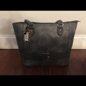 BRAND NEW purse with zipper closure.